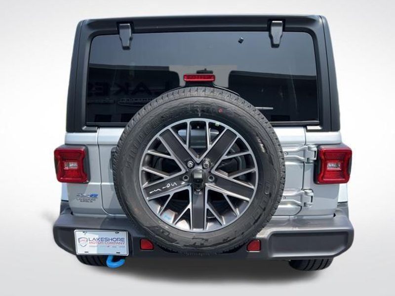 2023 Jeep Wrangler Sahara 4xe in a Silver Zynith Clear Coat exterior color and Blackinterior. Lakeshore CDJR Seaford 302-213-6058 lakeshorecdjr.com 