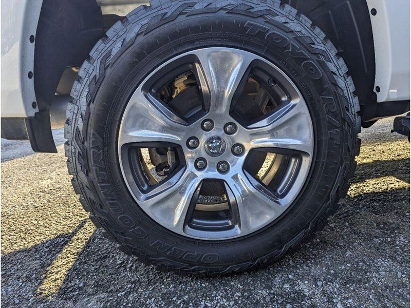 2021 RAM 1500 Laramie in a Bright White Clear Coat exterior color and Light Frost Beige/Mountain Browninterior. Johnson Dodge 601-693-6343 pixelmotiondemo.com 