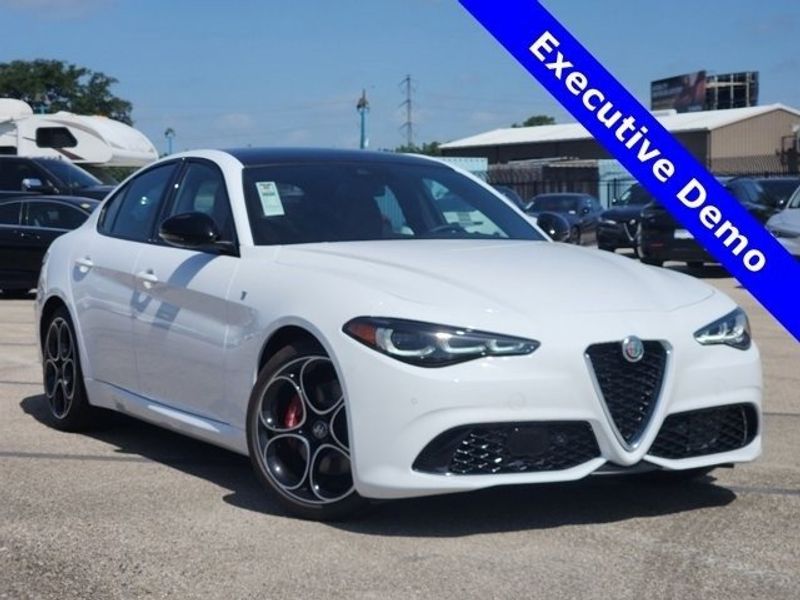 2024 Alfa Romeo Giulia Ti in a Alfa White exterior color and Saddle Browninterior. Northside Imports Houston 281-475-4549 northsideimportshouston.com 