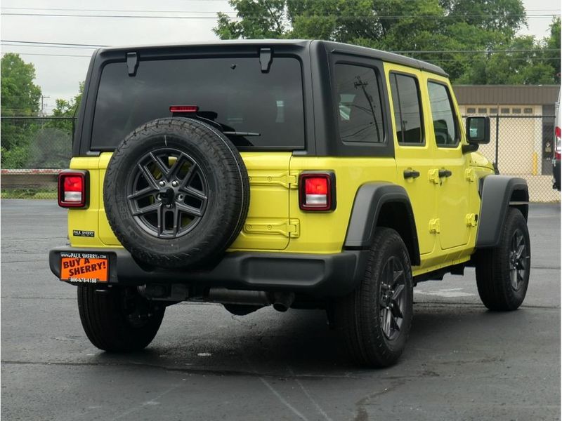 2024 Jeep Wrangler 4-door Sport S in a High Velocity Clear Coat exterior color and Blackinterior. Paul Sherry Chrysler Dodge Jeep RAM (937) 749-7061 sherrychrysler.net 