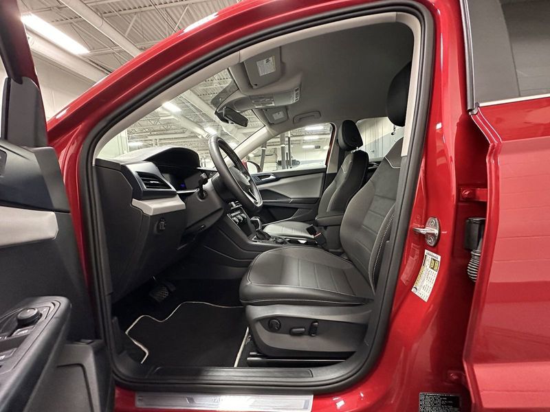 2023 Volkswagen Taos SE 4-Motion AWD w/Black Wheel Pkg in a Kings Red Metallic exterior color and Black heated seatsinterior. Schmelz Countryside Alfa Romeo (651) 867-3222 schmelzalfaromeo.com 