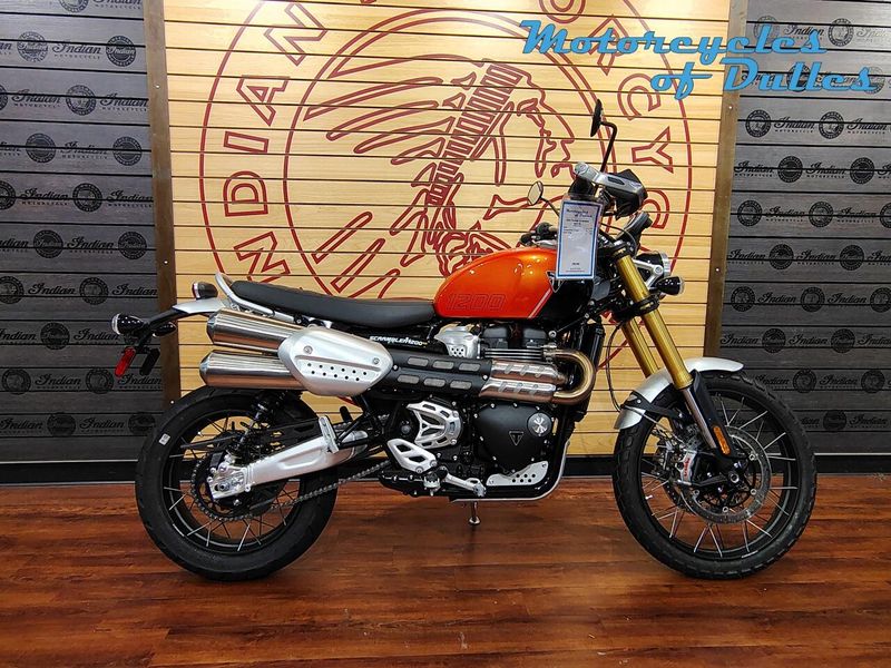 2024 Triumph Scrambler 1200 XE  in a Baja Orange/Phantom Black exterior color. Motorcycles of Dulles 571.934.4450 motorcyclesofdulles.com 