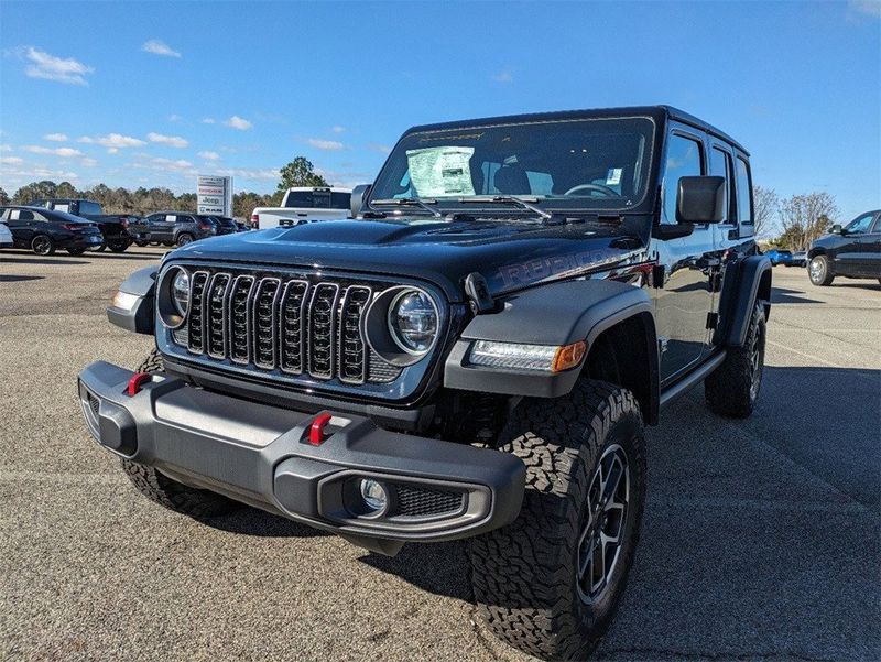 2024 Jeep Wrangler  Rubicon in a Black Clear Coat exterior color and Blackinterior. South Georgia CDJR 229-443-1466 southgeorgiacdjr.com 