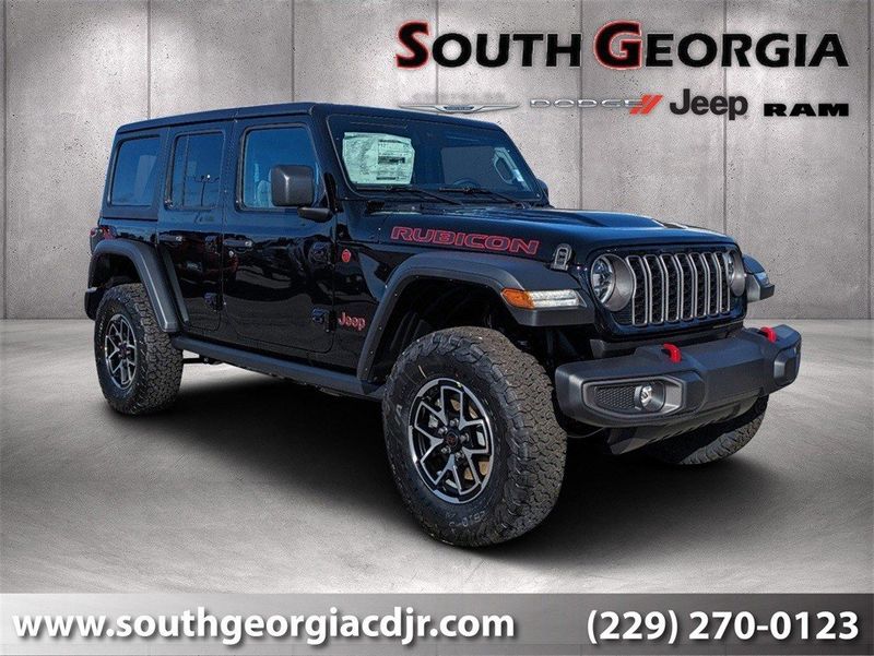 2024 Jeep Wrangler  Rubicon in a Black Clear Coat exterior color and Blackinterior. South Georgia CDJR 229-443-1466 southgeorgiacdjr.com 