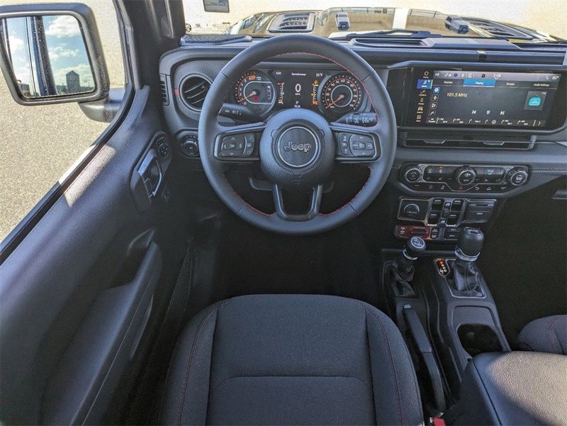 2024 Jeep Wrangler  Rubicon in a Black Clear Coat exterior color and Blackinterior. South Georgia CDJR 229-443-1466 southgeorgiacdjr.com 