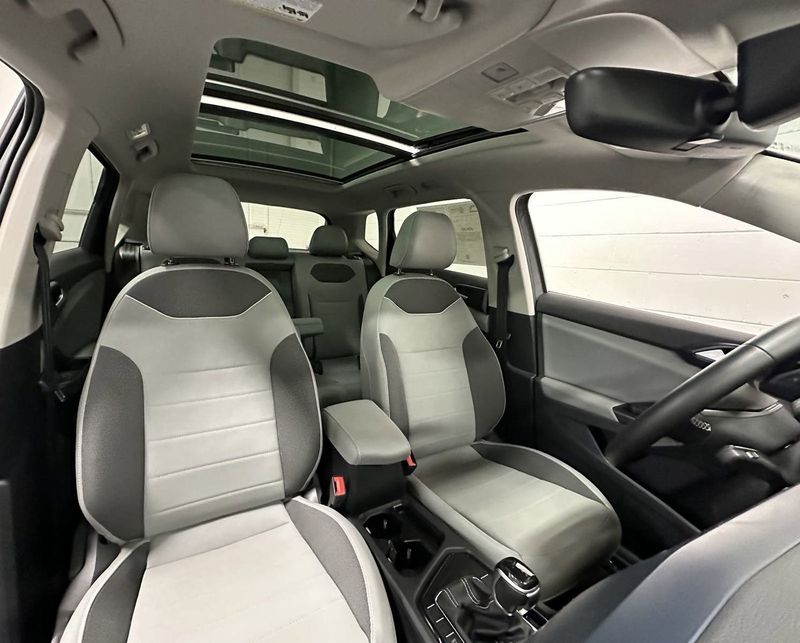 2023 Volkswagen Taos SE w/Sunroof & Black Wheel Pkg in a Pure Gray exterior color and Gray Heated Seatsinterior. Schmelz Countryside SAAB (888) 558-1064 stpaulsaab.com 