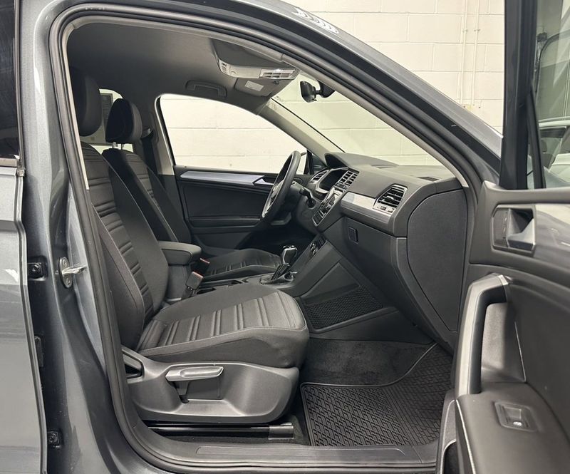 2023 Volkswagen Tiguan S w/ Dr Asst Pkg in a Platinum Gray Metallic exterior color and Black Heated Seatsinterior. Schmelz Countryside Alfa Romeo and Fiat (651) 968-0556 schmelzfiat.com 