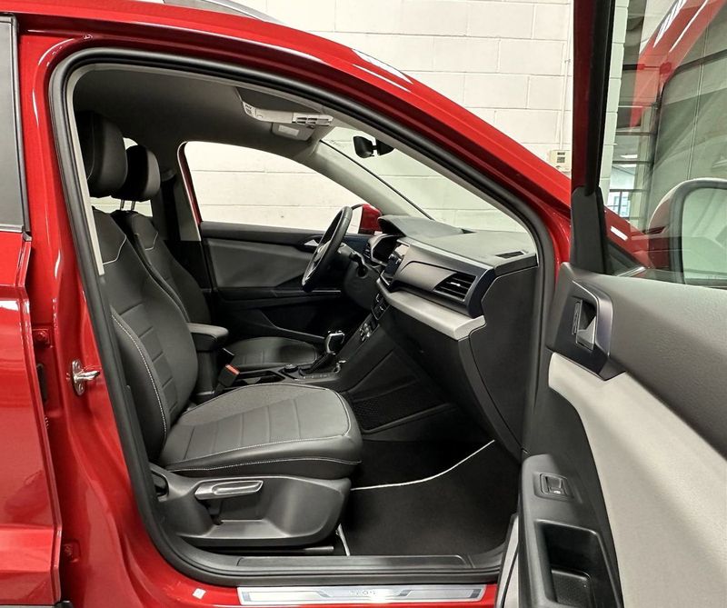 2023 Volkswagen Taos SE 4-Motion AWD w/Black Wheel Pkg in a Kings Red Metallic exterior color and Black heated seatsinterior. Schmelz Countryside Alfa Romeo and Fiat (651) 968-0556 schmelzfiat.com 