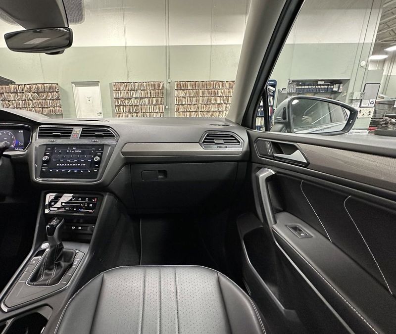 2023 Volkswagen Tiguan SE w/Sunroof & 3rd Row in a Pyrite Silver Metallic exterior color and Black Heated Seatsinterior. Schmelz Countryside Alfa Romeo (651) 867-3222 schmelzalfaromeo.com 