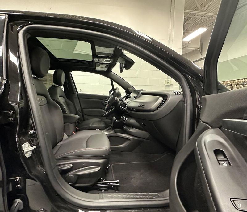 2022 Fiat 500X Sport AWD w/Sunroof in a Nero Cinema (Black Clear Coat) exterior color and Black Heated Seatsinterior. Schmelz Countryside SAAB (888) 558-1064 stpaulsaab.com 