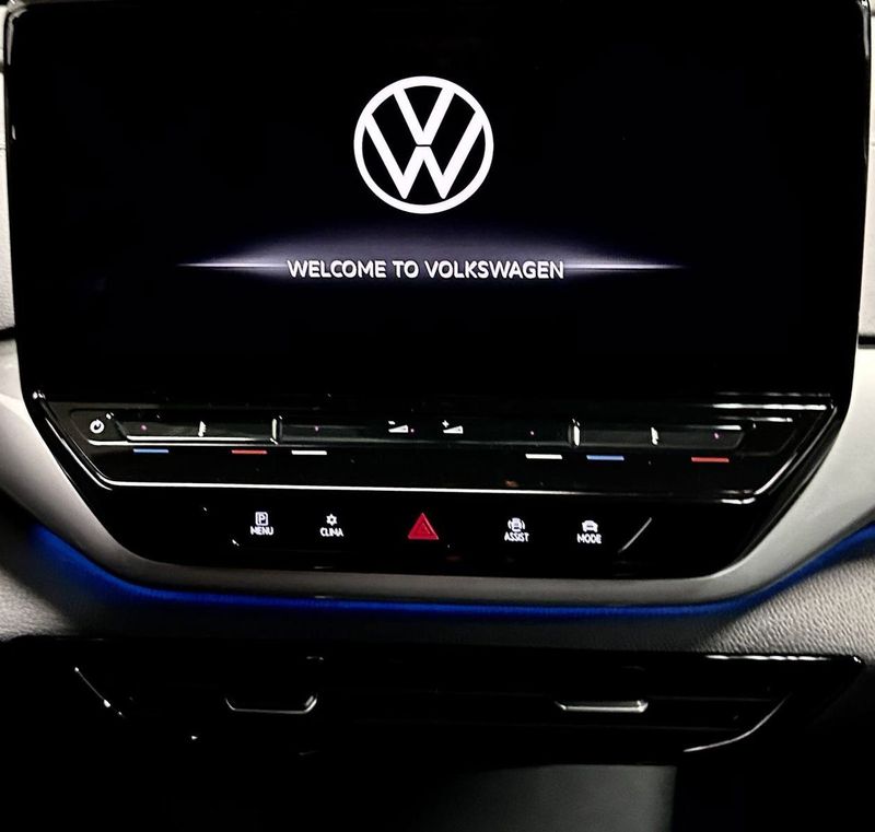 2023 Volkswagen ID.4 Pro S w/ Panoramic Roof in a Aurora Red Metallic exterior color and Black w/ Heated Massaging Seatsinterior. Schmelz Countryside Alfa Romeo (651) 867-3222 schmelzalfaromeo.com 