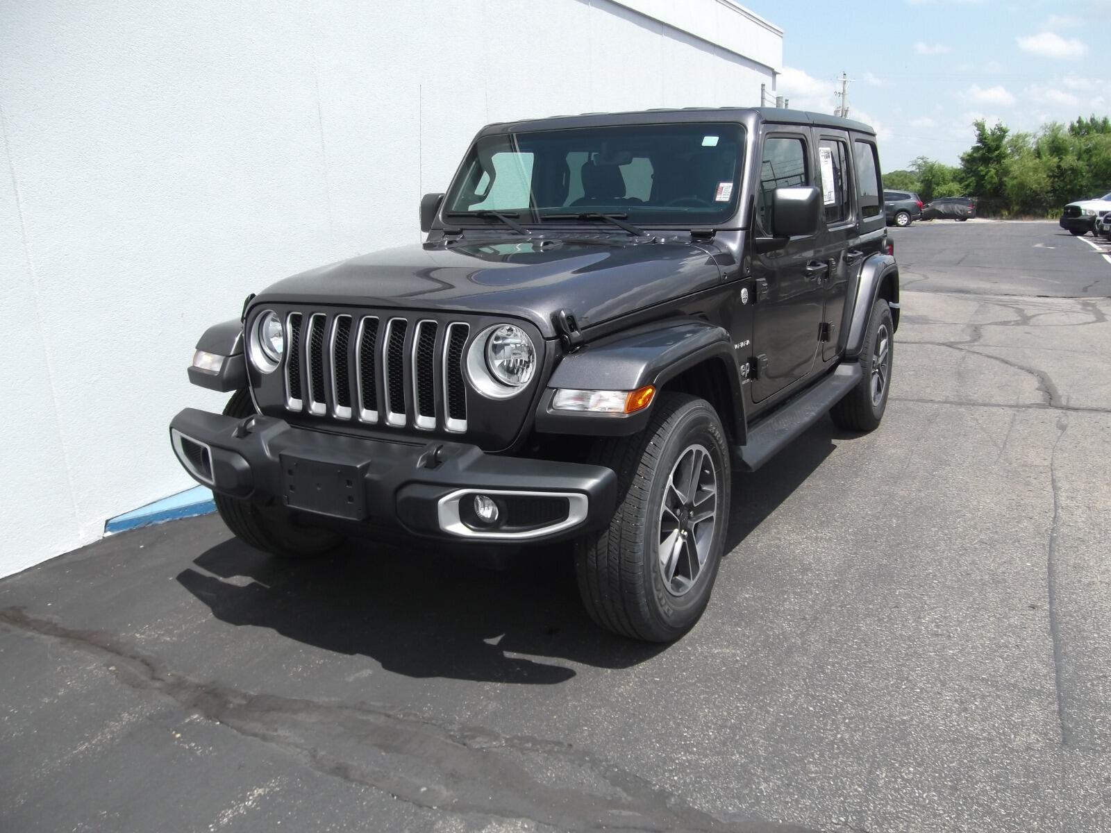 Used 2023 Jeep Wrangler 4-Door Sahara with VIN 1C4HJXEGXPW688935 for sale in Kansas City