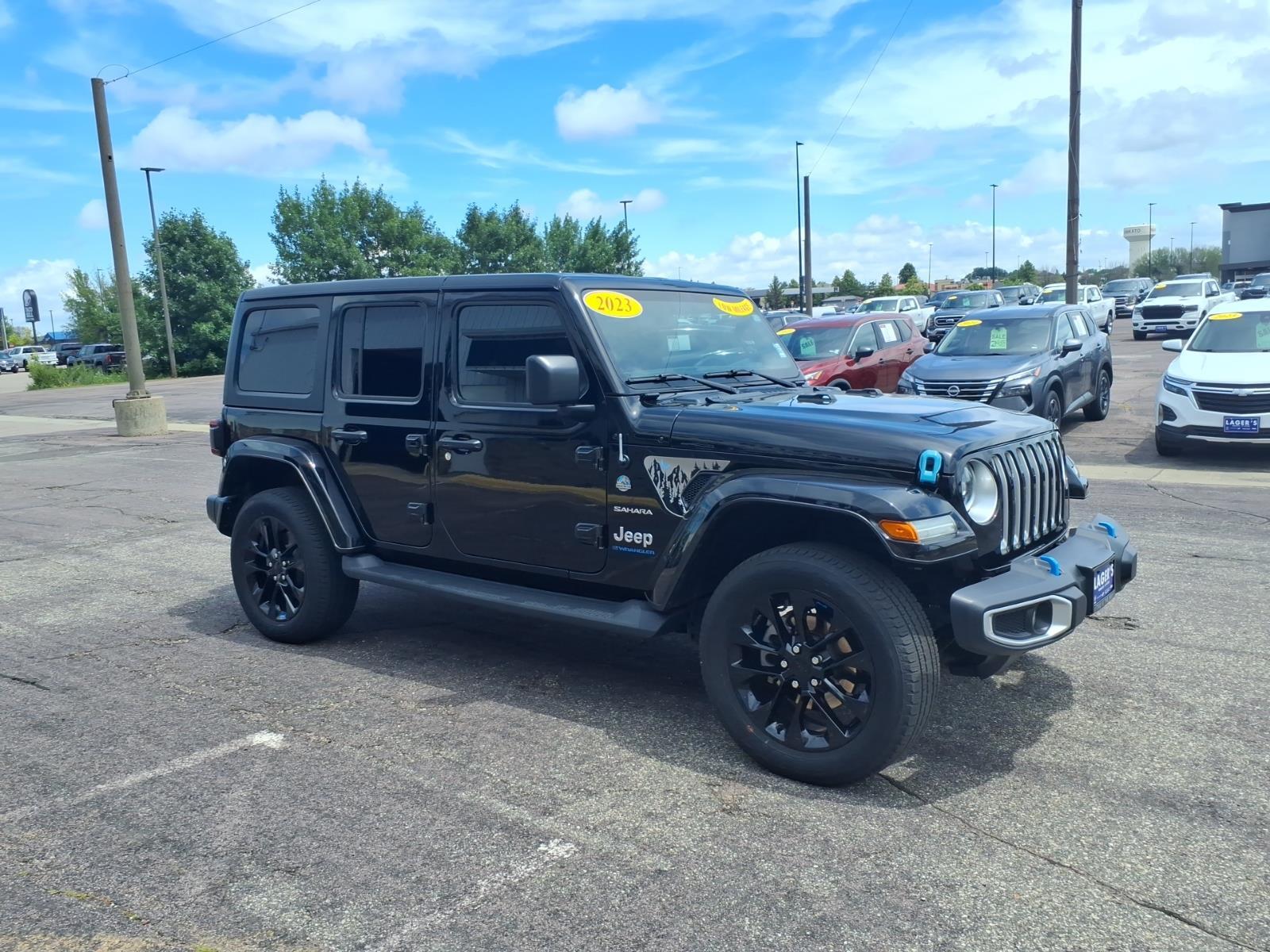 Used 2023 Jeep Wrangler 4xe Sahara 4XE with VIN 1C4JJXP65PW557496 for sale in Mankato, Minnesota