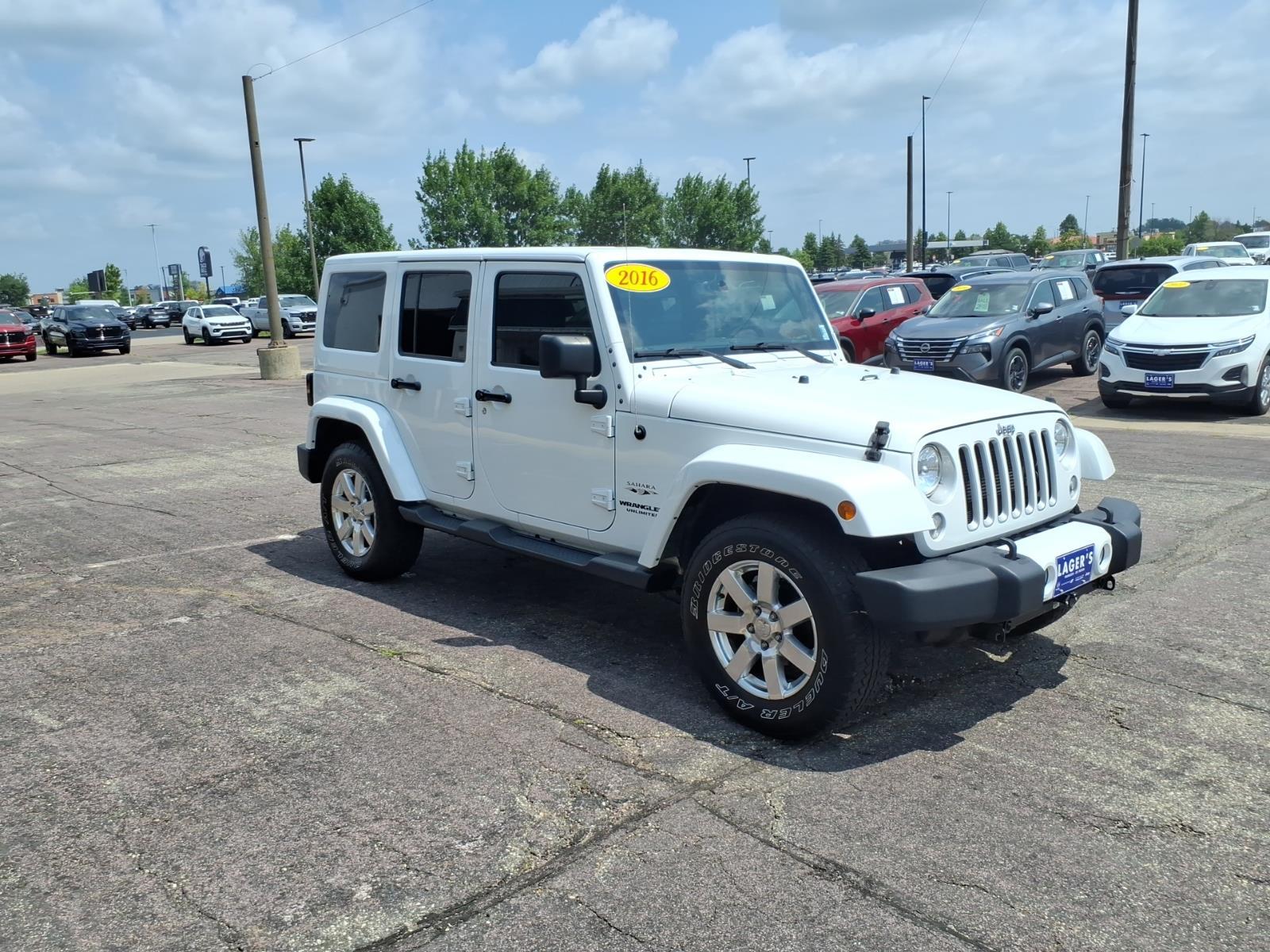 Used 2016 Jeep Wrangler Unlimited Sahara with VIN 1C4BJWEG4GL161345 for sale in Mankato, Minnesota
