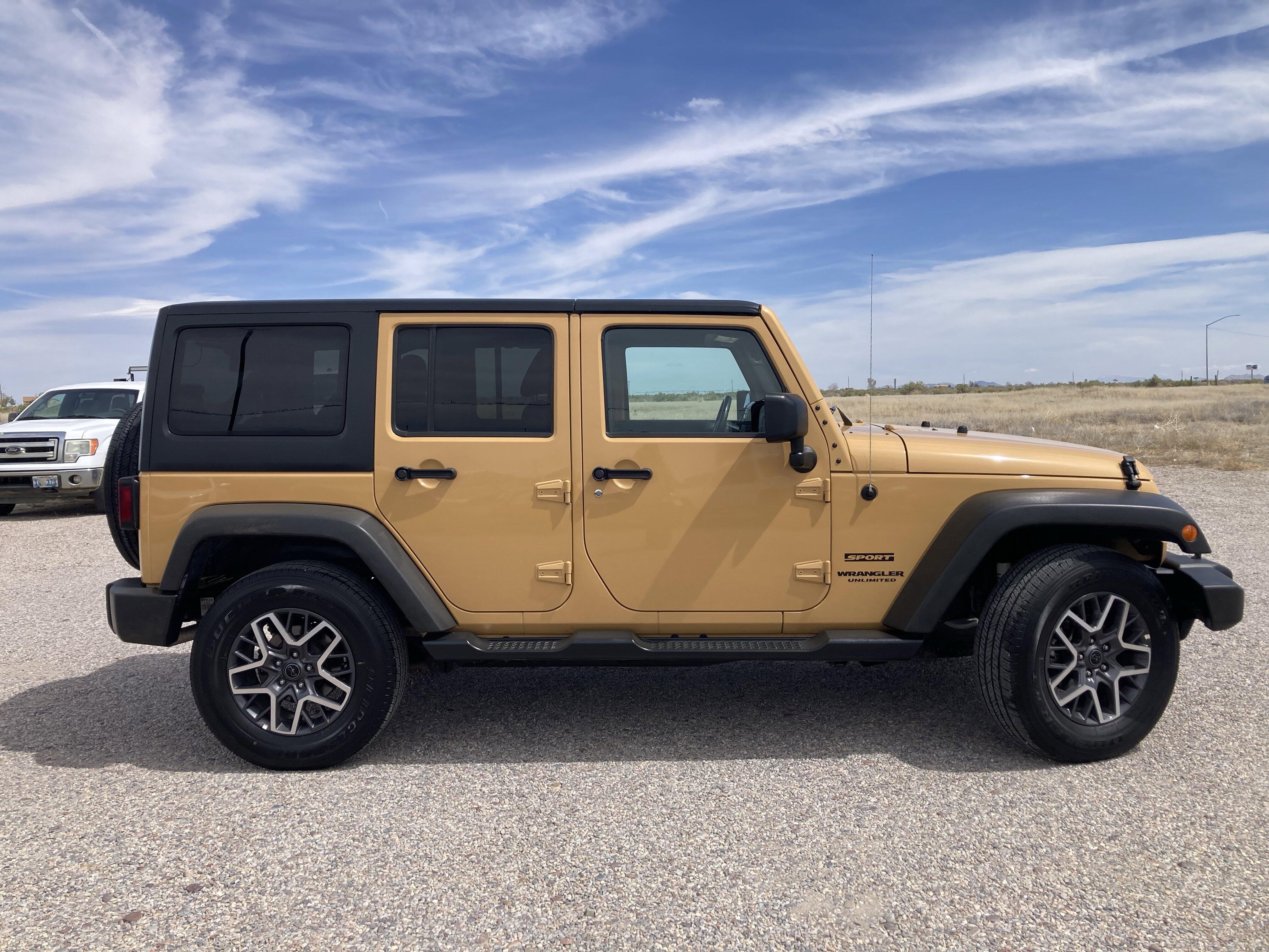 Used 2014 Jeep Wrangler Unlimited Sport with VIN 1C4BJWDG0EL100962 for sale in Delta, UT