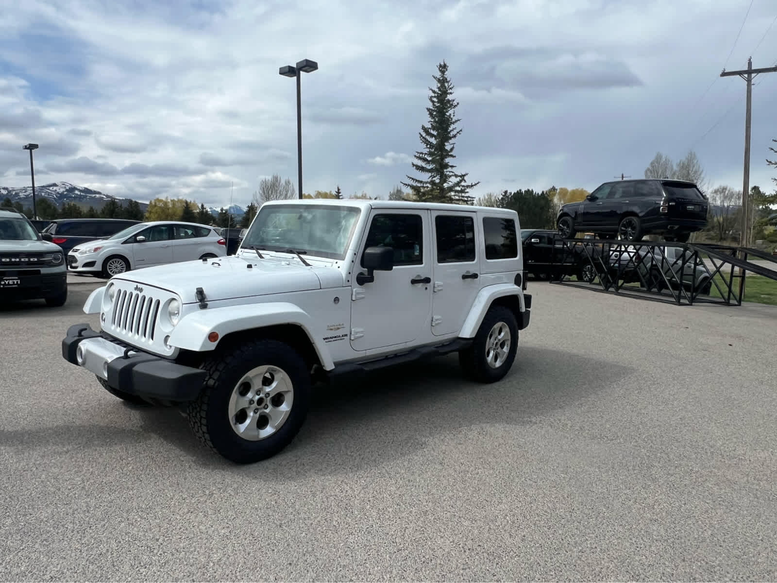 Used 2014 Jeep Wrangler Unlimited Sahara with VIN 1C4HJWEG1EL195606 for sale in Jackson, WY