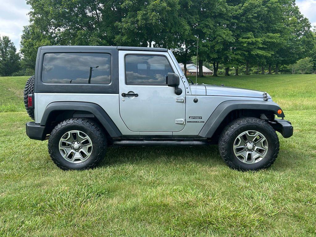 Used 2013 Jeep Wrangler Sport with VIN 1C4AJWAG1DL666563 for sale in Angola, IN